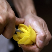 Carving flower out of vegetable